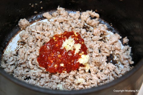 Add chili paste and garlic and cook until pungent